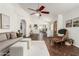 Spacious living area with a comfortable sofa, elegant hardwood floors, and easy access to other living spaces at 18219 N 19Th St, Phoenix, AZ 85022
