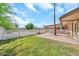 Charming backyard featuring a well-manicured lawn, white picket fence and brick paver patio at 18428 N 42Nd St, Phoenix, AZ 85032
