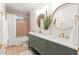 Bright bathroom boasts double sinks, modern fixtures, and a large mirror, adding elegance at 18428 N 42Nd St, Phoenix, AZ 85032