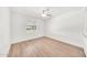 Bright bedroom with light wood floors and a large window at 18428 N 42Nd St, Phoenix, AZ 85032