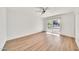 A bright bedroom with light wood floors and sliding glass doors leading to a patio at 18428 N 42Nd St, Phoenix, AZ 85032