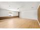 Spacious bonus room with brick accents, laminate flooring, and ample natural light at 18428 N 42Nd St, Phoenix, AZ 85032