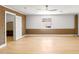 Spacious bonus room with brick accents and updated flooring, offering plenty of natural light at 18428 N 42Nd St, Phoenix, AZ 85032