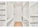 Walk-in closet featuring ample shelving and storage space at 18428 N 42Nd St, Phoenix, AZ 85032