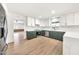 Spacious, bright kitchen features updated white cabinets, and a stylish green island at 18428 N 42Nd St, Phoenix, AZ 85032