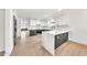 Bright kitchen boasts sleek white and green cabinets, modern appliances, and spacious quartz countertops at 18428 N 42Nd St, Phoenix, AZ 85032
