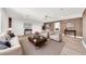 Staged living room with fireplace, brick accent wall, and modern decor at 18428 N 42Nd St, Phoenix, AZ 85032