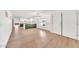Bright, open-concept space featuring laminate flooring and an island kitchen with white countertops at 18428 N 42Nd St, Phoenix, AZ 85032