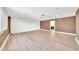 Living room with brick accent wall and light wood floors at 18428 N 42Nd St, Phoenix, AZ 85032