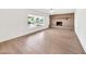 Bright open living room featuring a fireplace and a large picture window at 18428 N 42Nd St, Phoenix, AZ 85032