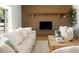 Inviting living room with a brick fireplace, a wooden mantle, and stylish decor at 18428 N 42Nd St, Phoenix, AZ 85032