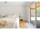 Peaceful bedroom featuring sliding glass doors leading to the outdoor patio at 18428 N 42Nd St, Phoenix, AZ 85032
