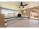 Spacious covered patio with a fireplace and built-in seating, perfect for outdoor entertaining and relaxation at 18428 N 42Nd St, Phoenix, AZ 85032