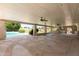 Expansive covered patio with brick flooring, ceiling fans, and views of the sparkling pool at 18428 N 42Nd St, Phoenix, AZ 85032