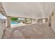 Covered patio overlooking the pool and landscaped backyard at 18428 N 42Nd St, Phoenix, AZ 85032