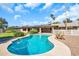 Sparkling pool and patio area, complete with wooden lounge chairs and manicured landscaping at 18428 N 42Nd St, Phoenix, AZ 85032