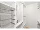 Organized walk-in closet with a mirror, plenty of shelves, and metal wire baskets at 18428 N 42Nd St, Phoenix, AZ 85032