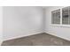 Neutral bedroom with plush carpet and shuttered window at 2015 E Glenhaven Dr, Phoenix, AZ 85048