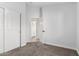 Bedroom featuring neutral decor and carpet with a closet and bathroom access at 2015 E Glenhaven Dr, Phoenix, AZ 85048