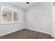 Neutral bedroom featuring shuttered windows and neutral-toned carpeting at 2015 E Glenhaven Dr, Phoenix, AZ 85048