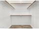 Walk-in closet with installed shelving provides optimal storage space at 2015 E Glenhaven Dr, Phoenix, AZ 85048