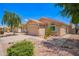 Charming single-story home features terracotta tile roof, two-car garage, and desert landscaping at 2015 E Glenhaven Dr, Phoenix, AZ 85048