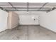 Spacious garage with built-in storage cabinets and a clean, sealed concrete floor at 2015 E Glenhaven Dr, Phoenix, AZ 85048
