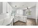 Bright eat-in kitchen features white cabinets, white countertops, and stainless steel appliances at 2015 E Glenhaven Dr, Phoenix, AZ 85048