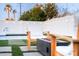 Inviting backyard with pool, unicorn float, fire pit, and lounge seating, perfect for relaxation at 2023 N 79Th Pl, Scottsdale, AZ 85257