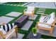 Backyard features a fire pit, stone pavers set in artificial grass, and comfortable lounge seating at 2023 N 79Th Pl, Scottsdale, AZ 85257