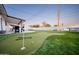 Entertainer's backyard featuring putting green, ping pong and outdoor seating at 2023 N 79Th Pl, Scottsdale, AZ 85257
