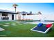 Spacious backyard featuring a pool, lawn, and outdoor dining, perfect for entertaining at 2023 N 79Th Pl, Scottsdale, AZ 85257