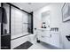 A sleek, modern bathroom featuring a shower-tub combination and a floating vanity at 2023 N 79Th Pl, Scottsdale, AZ 85257