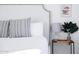Close-up of a well-decorated bed with a studded headboard and stylish bedside table at 2023 N 79Th Pl, Scottsdale, AZ 85257