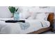 Bedroom scene showcasing a tray with water bottles, accent pillows, and a cozy knitted throw on a neatly made bed at 2023 N 79Th Pl, Scottsdale, AZ 85257