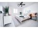Inviting bedroom with white tile floors, light wood accents, and a ceiling fan at 2023 N 79Th Pl, Scottsdale, AZ 85257