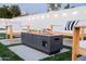 Modern fire pit with concrete surround and comfortable outdoor seating creates a relaxing backyard gathering space at 2023 N 79Th Pl, Scottsdale, AZ 85257