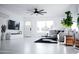 Bright living room with a ceiling fan, tile floors, and a contemporary design at 2023 N 79Th Pl, Scottsdale, AZ 85257