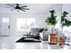 Bright living room with sleek tile flooring, modern decor, and comfortable seating at 2023 N 79Th Pl, Scottsdale, AZ 85257
