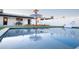 Sparkling pool with lounge chairs, umbrella, and a playful unicorn float at 2023 N 79Th Pl, Scottsdale, AZ 85257