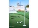 Lush backyard putting green, perfect for golf enthusiasts to practice their short game at 2023 N 79Th Pl, Scottsdale, AZ 85257