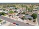 Neighborhood view featuring a home with a backyard pool, desert landscaping, and solar panels on roof at 207 E Strahan Dr, Tempe, AZ 85283