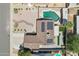Aerial view of house with a swimming pool, solar panels, covered patio, and desert landscaping at 207 E Strahan Dr, Tempe, AZ 85283