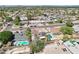 Expansive aerial view of the neighborhood featuring various homes and pools on a sunny day at 207 E Strahan Dr, Tempe, AZ 85283