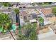 A gorgeous aerial view of a pool, solar panels, grass backyard, and desert landscaping at 207 E Strahan Dr, Tempe, AZ 85283