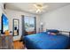 Bedroom featuring hardwood floors, a ceiling fan, a window for natural light, and neutral walls at 207 E Strahan Dr, Tempe, AZ 85283