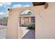 Charming home featuring an arched entry and a view of the front door with desert landscaping at 207 E Strahan Dr, Tempe, AZ 85283