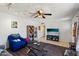 Cozy living room showcasing hardwood floors, ceiling fan, neutral paint, and bright, natural lighting at 207 E Strahan Dr, Tempe, AZ 85283