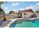 Backyard featuring a swimming pool, partially covered patio and a grilling area at 207 E Strahan Dr, Tempe, AZ 85283