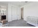 Bedroom area with crib, closet and access to bathroom at 22306 N 34Th Pl, Phoenix, AZ 85050